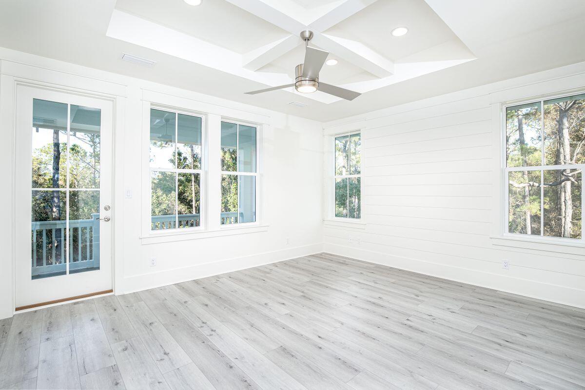 274 Redbud Ln Inlet Beach Inlet Beach, FL 32461 - Photo 14 of 25 a view of an empty room with wooden floor and a window