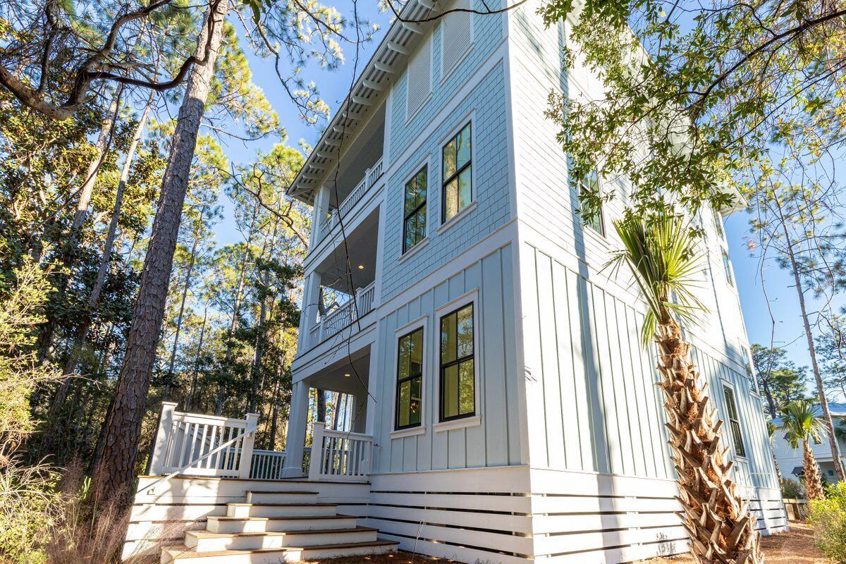 274 Redbud Ln Inlet Beach Inlet Beach, FL 32461 - Photo 20 of 25 a view of a brick house with a yard