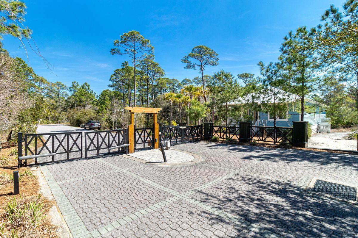 274 Redbud Ln Inlet Beach Inlet Beach, FL 32461 - Photo 23 of 25 a view of a house with a yard