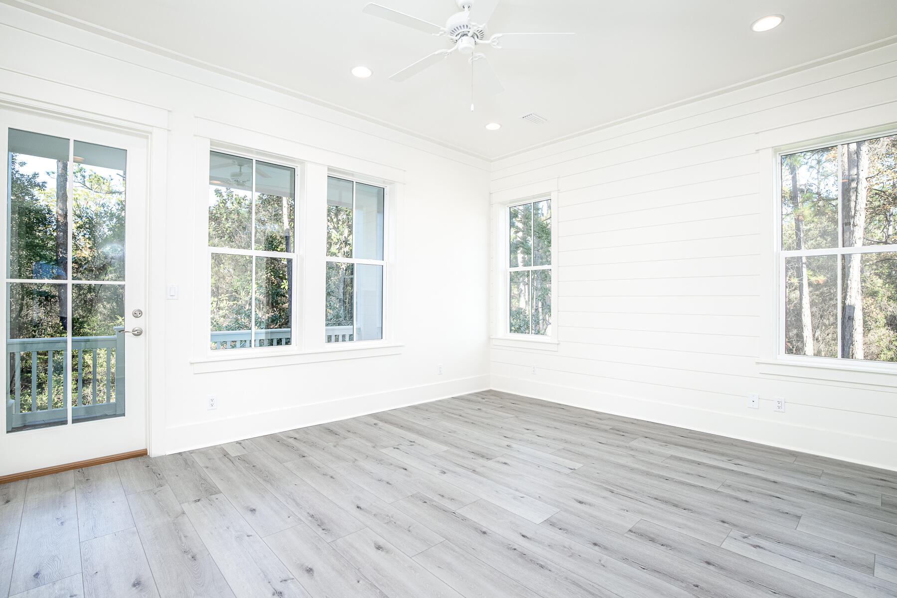 274 Redbud Ln Inlet Beach Inlet Beach, FL 32461 - Photo 7 of 25 a view of an empty room with wooden floor and a window