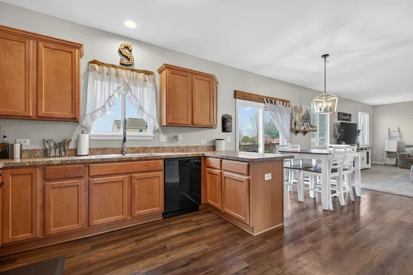 a kitchen with stainless steel appliances granite countertop counter space a sink and cabinets