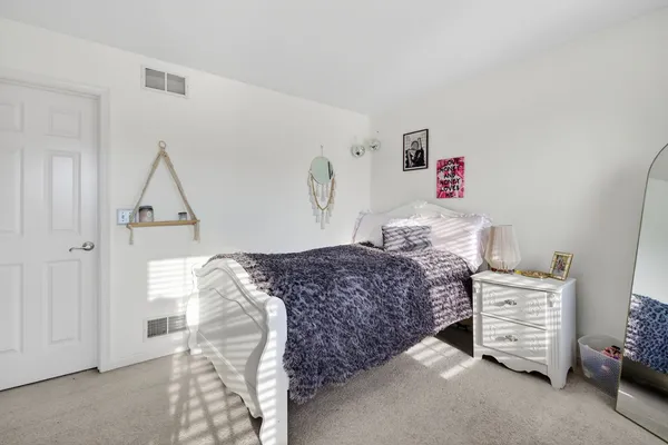 a bedroom with a bed and a cabinets