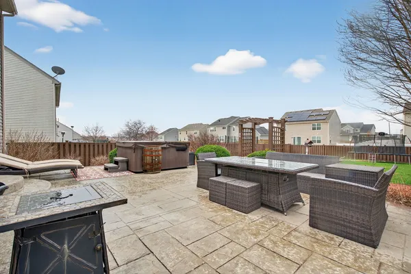 a view of a terrace with furniture and city view