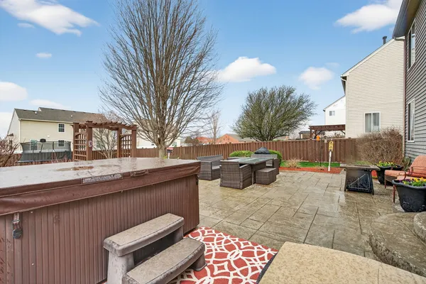 a view of a patio with couches and potted plants