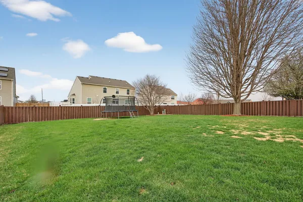 a view of a house with a back yard