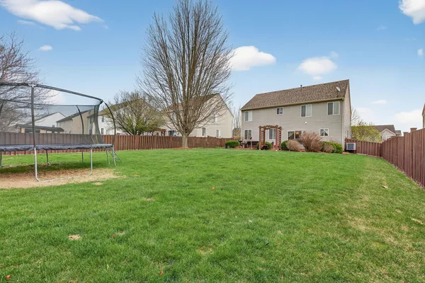 a view of a house with a back yard