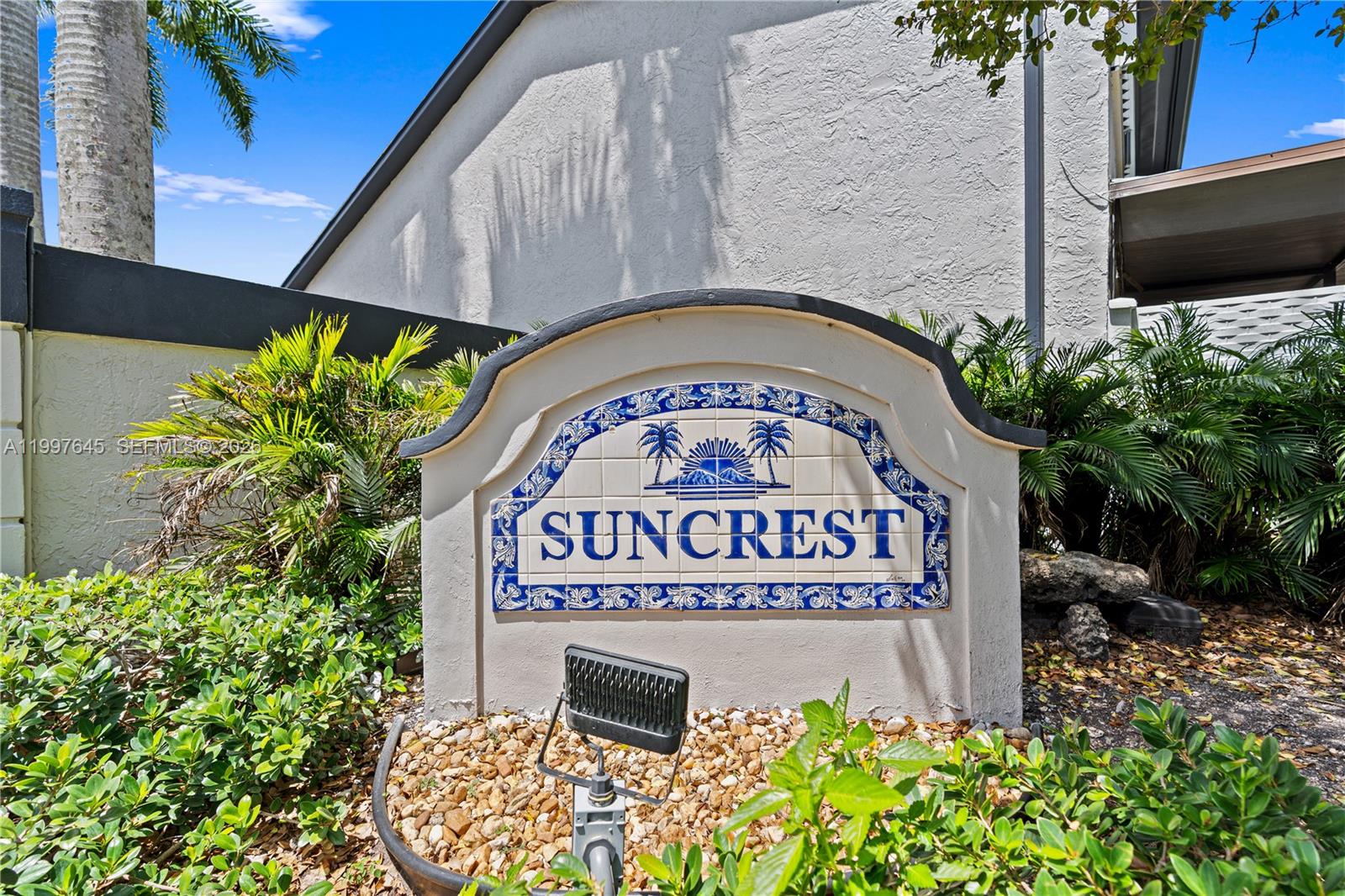 a sign that is on a brick wall