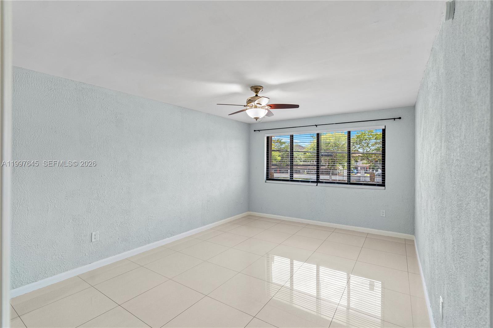 8748 Southwest 154th Cir Place, Unit 6N Miami, FL 33193 - Photo 19 of 34 a view of an empty room with a window