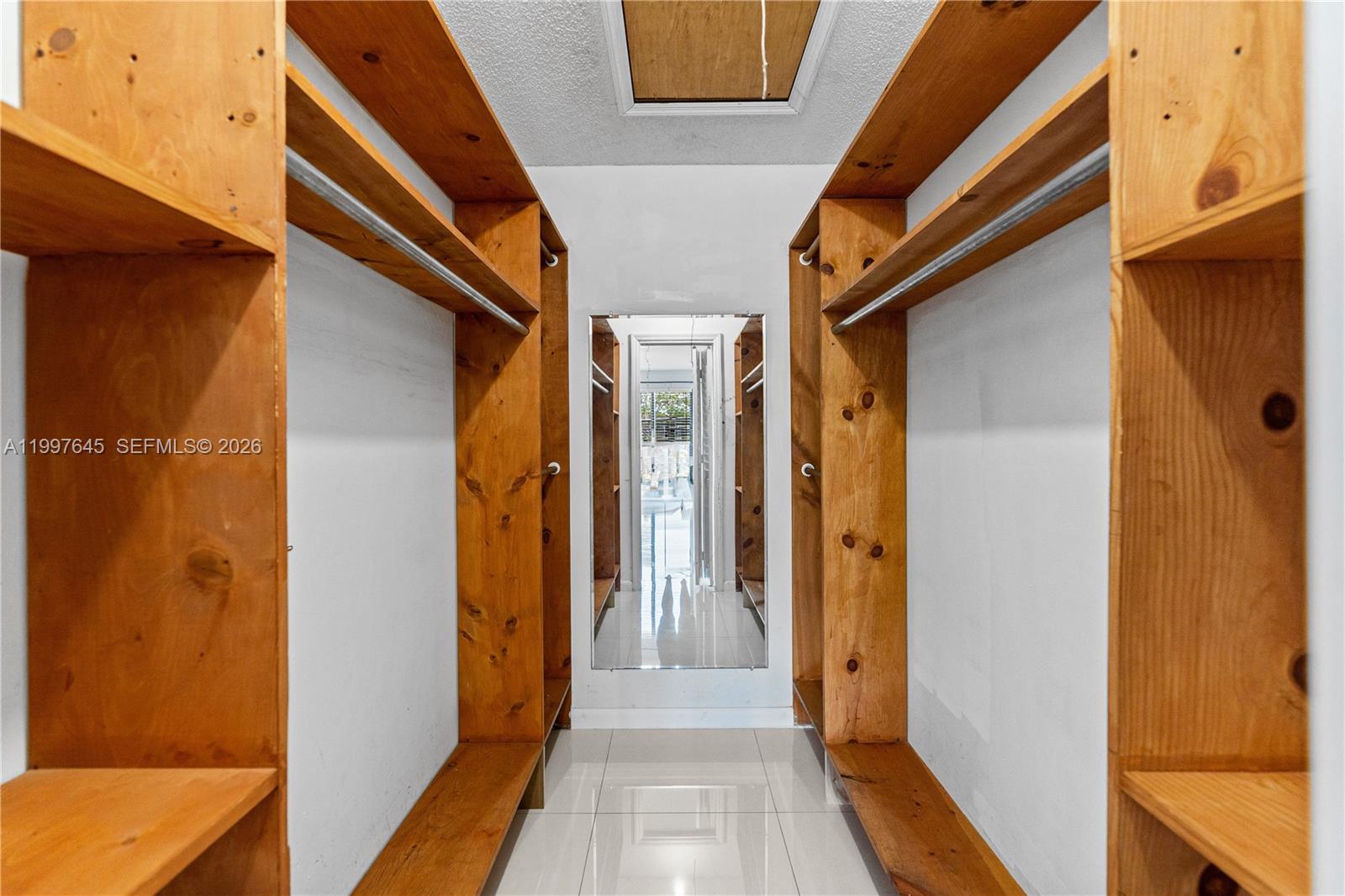 8748 Southwest 154th Cir Place, Unit 6N Miami, FL 33193 - Photo 22 of 34 a view of a hallway with wooden floor and staircase