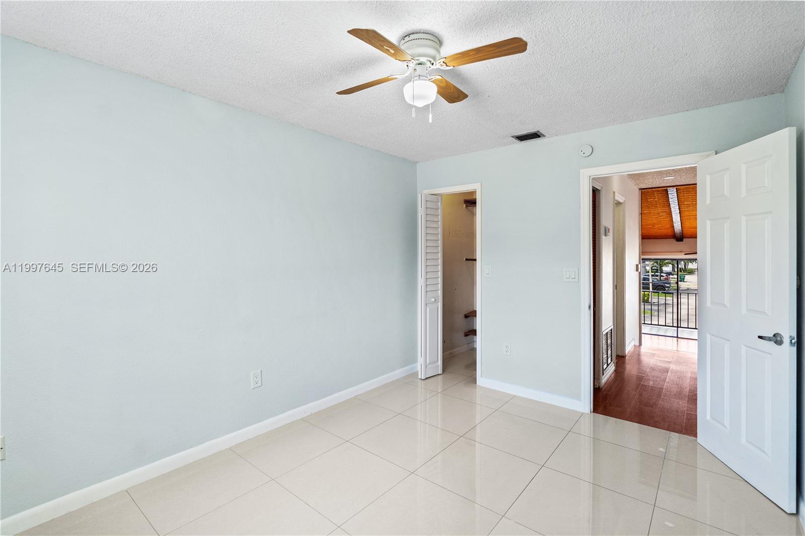 8748 Southwest 154th Cir Place, Unit 6N Miami, FL 33193 - Photo 24 of 34 wooden floor in an empty room