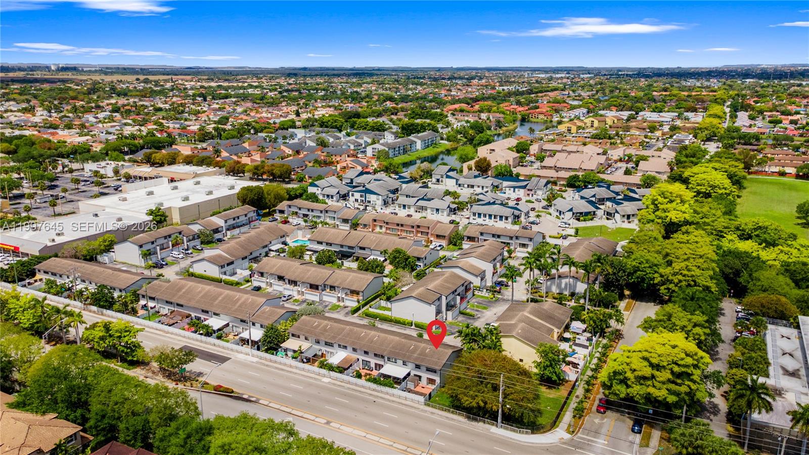 8748 Southwest 154th Cir Place, Unit 6N Miami, FL 33193 - Photo 32 of 34 an aerial view of a city with lots of residential buildings