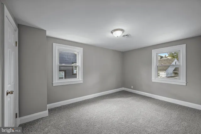 an empty room with windows