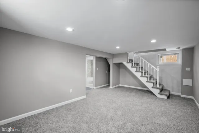 a view of an empty room with stairs