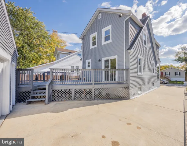 a front view of a house with iron fence