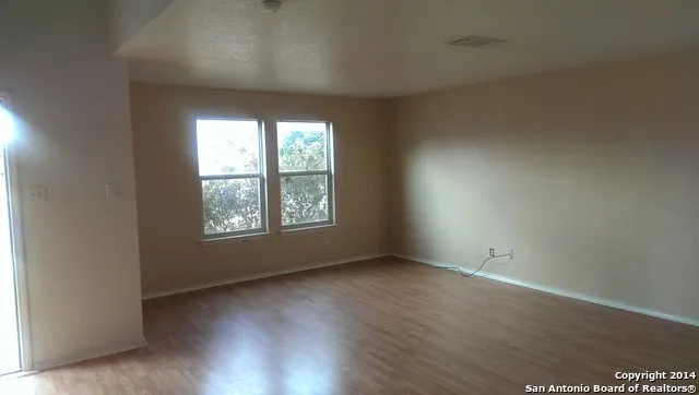 a view of a porch with furniture and garden