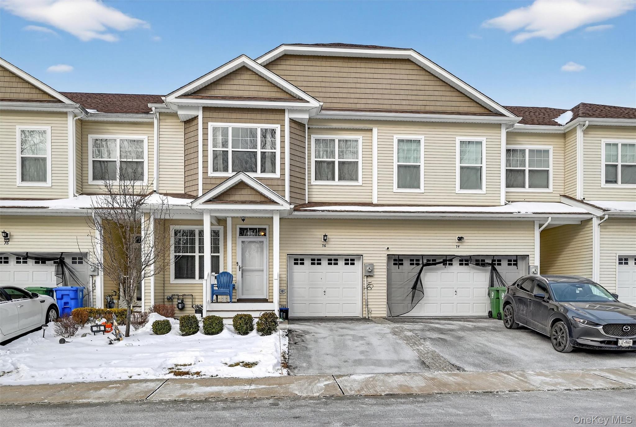 a view of a car park in front of house