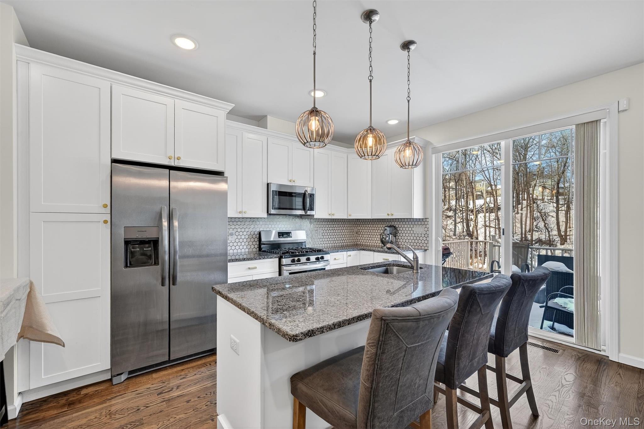 76 Magnolia Park Road Middletown, NY 10940 - Photo 11 of 39 a kitchen with stainless steel appliances granite countertop a kitchen island hardwood floor and a sink