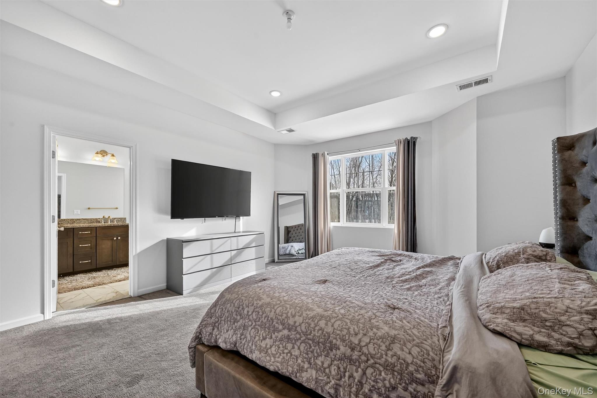 76 Magnolia Park Road Middletown, NY 10940 - Photo 19 of 39 a bedroom with a bed and a flat screen tv