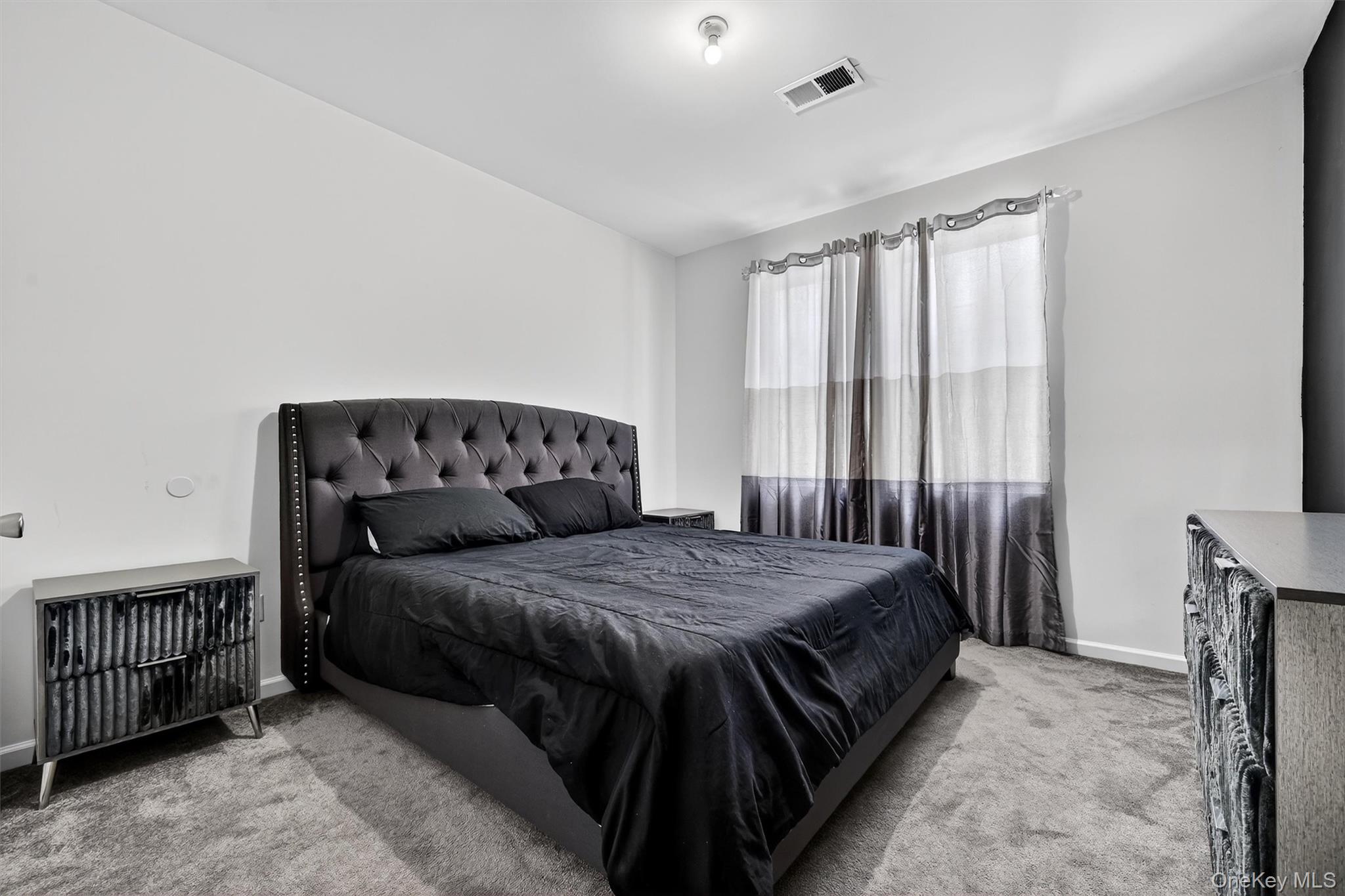 76 Magnolia Park Road Middletown, NY 10940 - Photo 25 of 39 a bedroom with a bed and a window