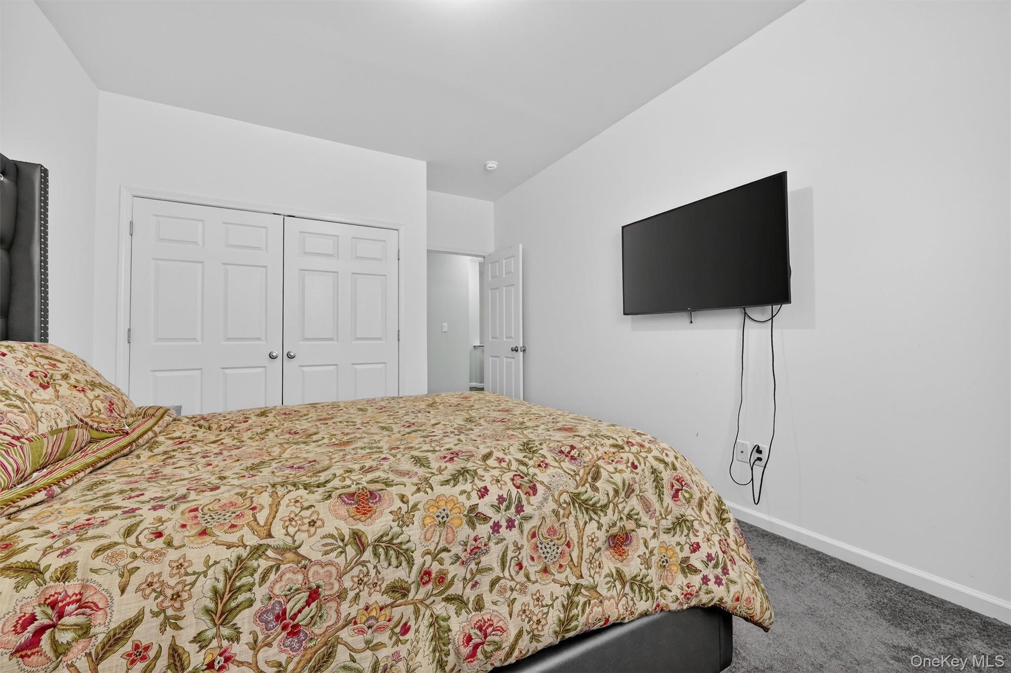 76 Magnolia Park Road Middletown, NY 10940 - Photo 28 of 39 a bedroom with a bed and a flat screen tv