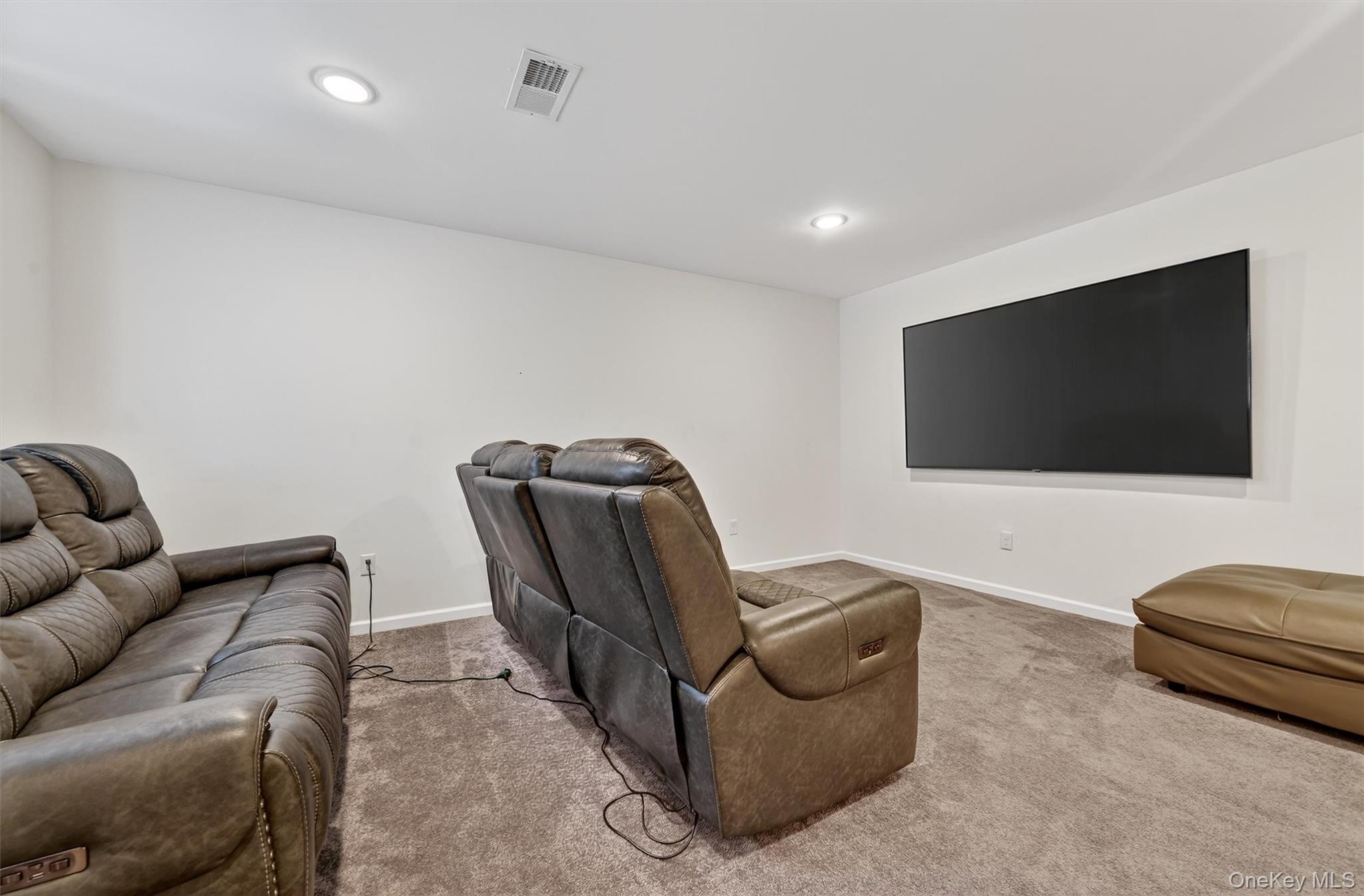 76 Magnolia Park Road Middletown, NY 10940 - Photo 31 of 39 a living room with furniture and a flat screen tv
