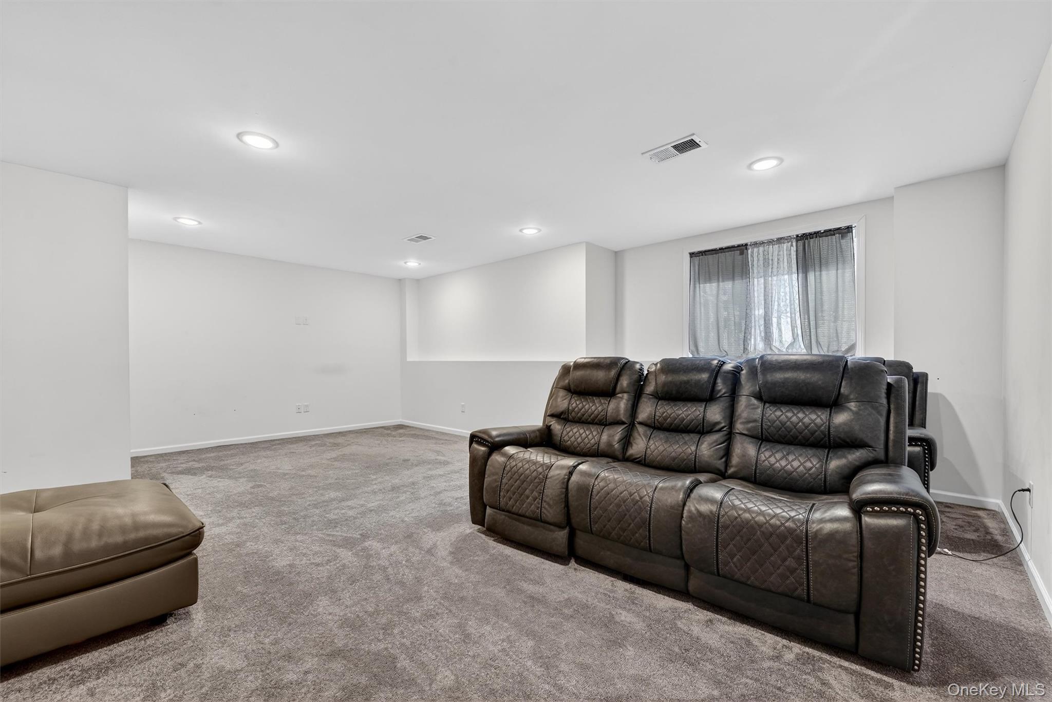 76 Magnolia Park Road Middletown, NY 10940 - Photo 32 of 39 a living room with a couch and a couch