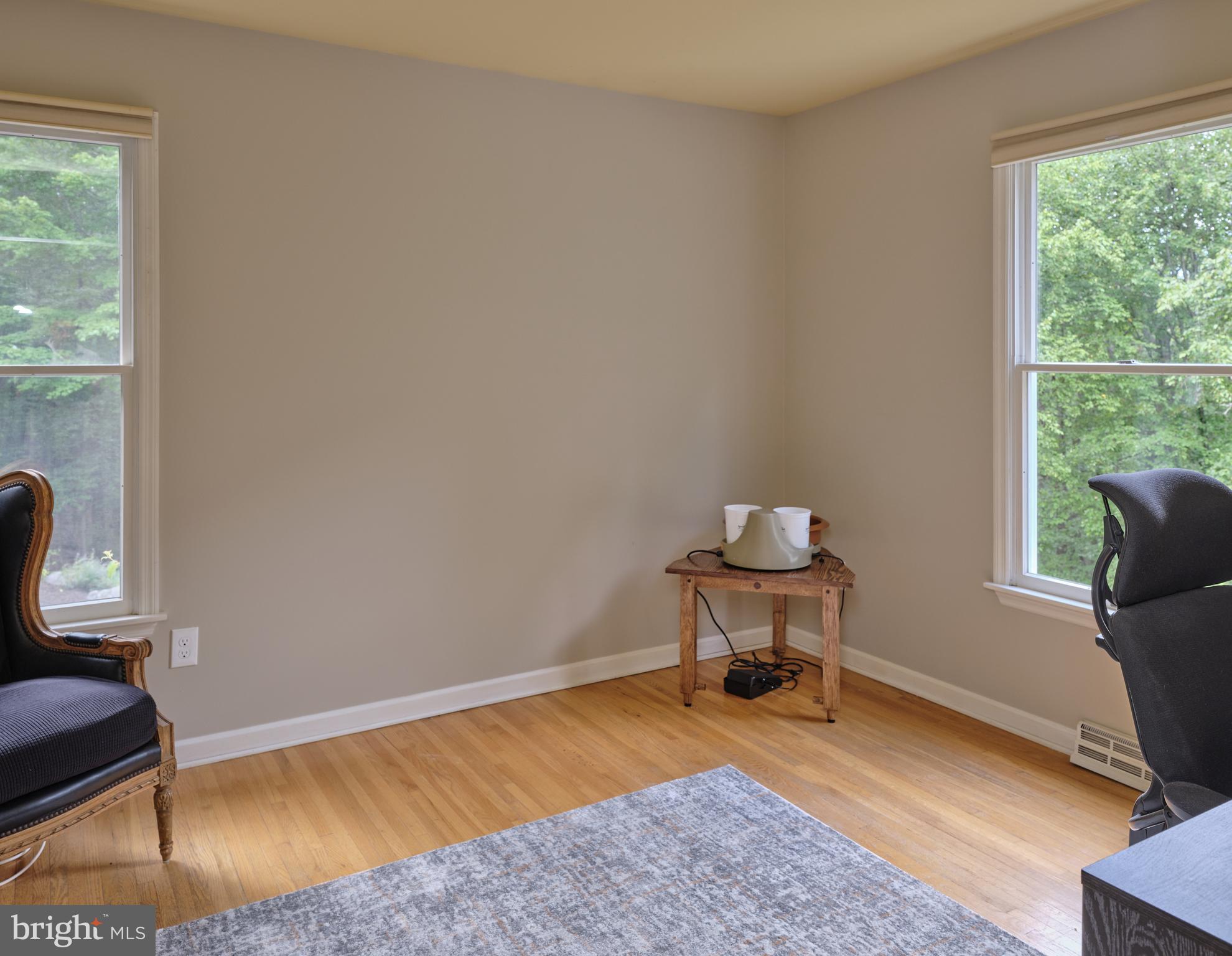 71 Big Spring Road Califon, NJ 07830 - Photo 17 of 41 a bedroom with a bed and a chair