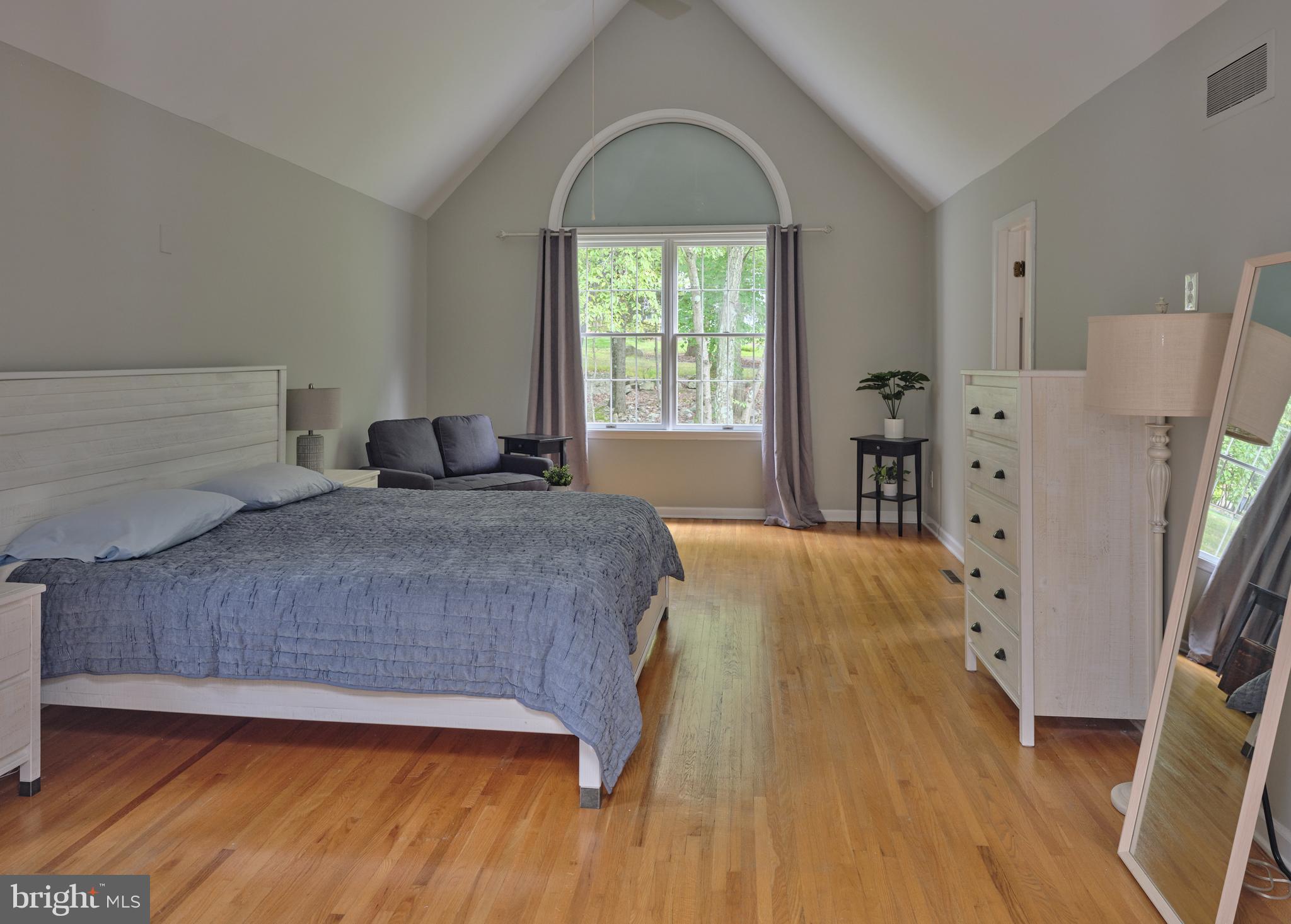 71 Big Spring Road Califon, NJ 07830 - Photo 20 of 41 a bedroom with a bed and a large window