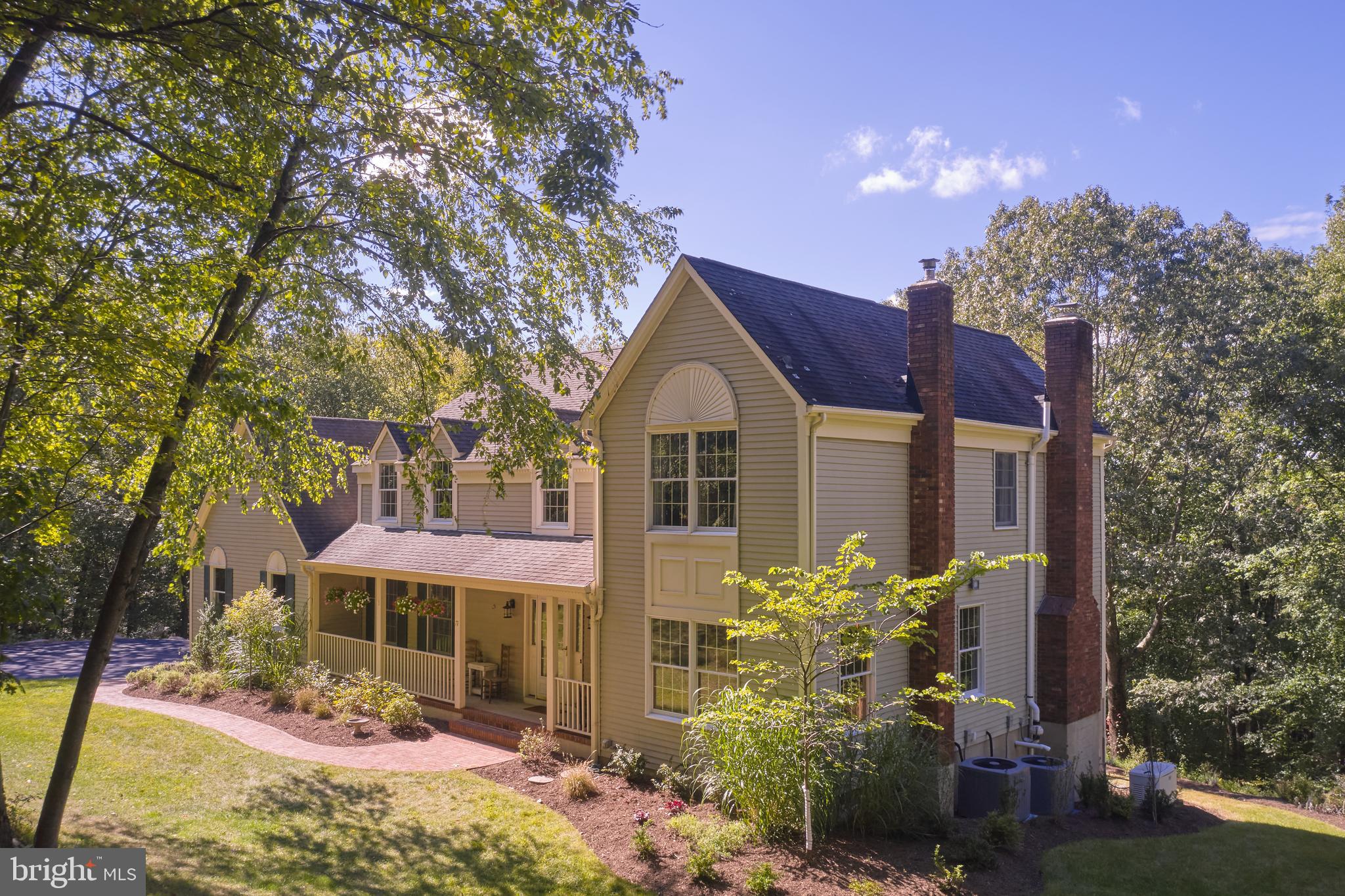 71 Big Spring Road Califon, NJ 07830 - Photo 2 of 41 a front view of a house with a yard