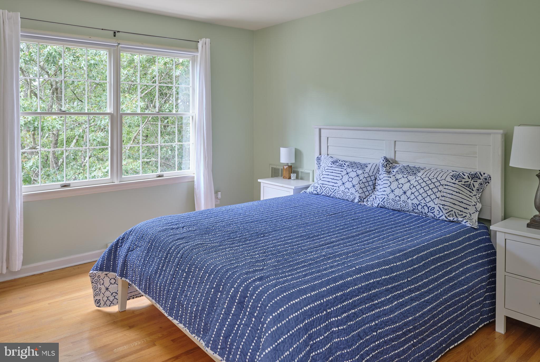 71 Big Spring Road Califon, NJ 07830 - Photo 25 of 41 a bedroom with a bed and wooden floor