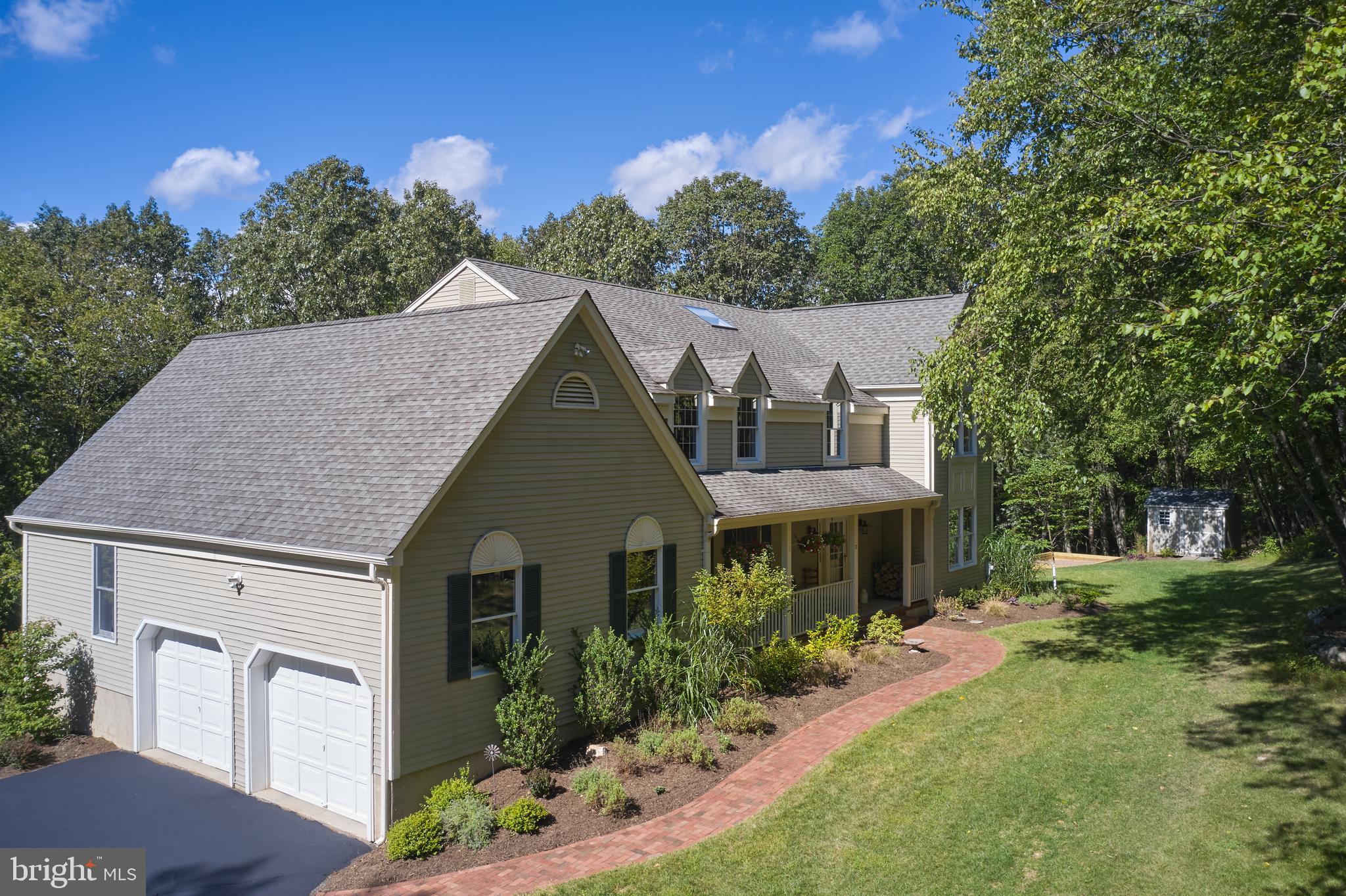 71 Big Spring Road Califon, NJ 07830 - Photo 3 of 41 a front view of a house with a yard