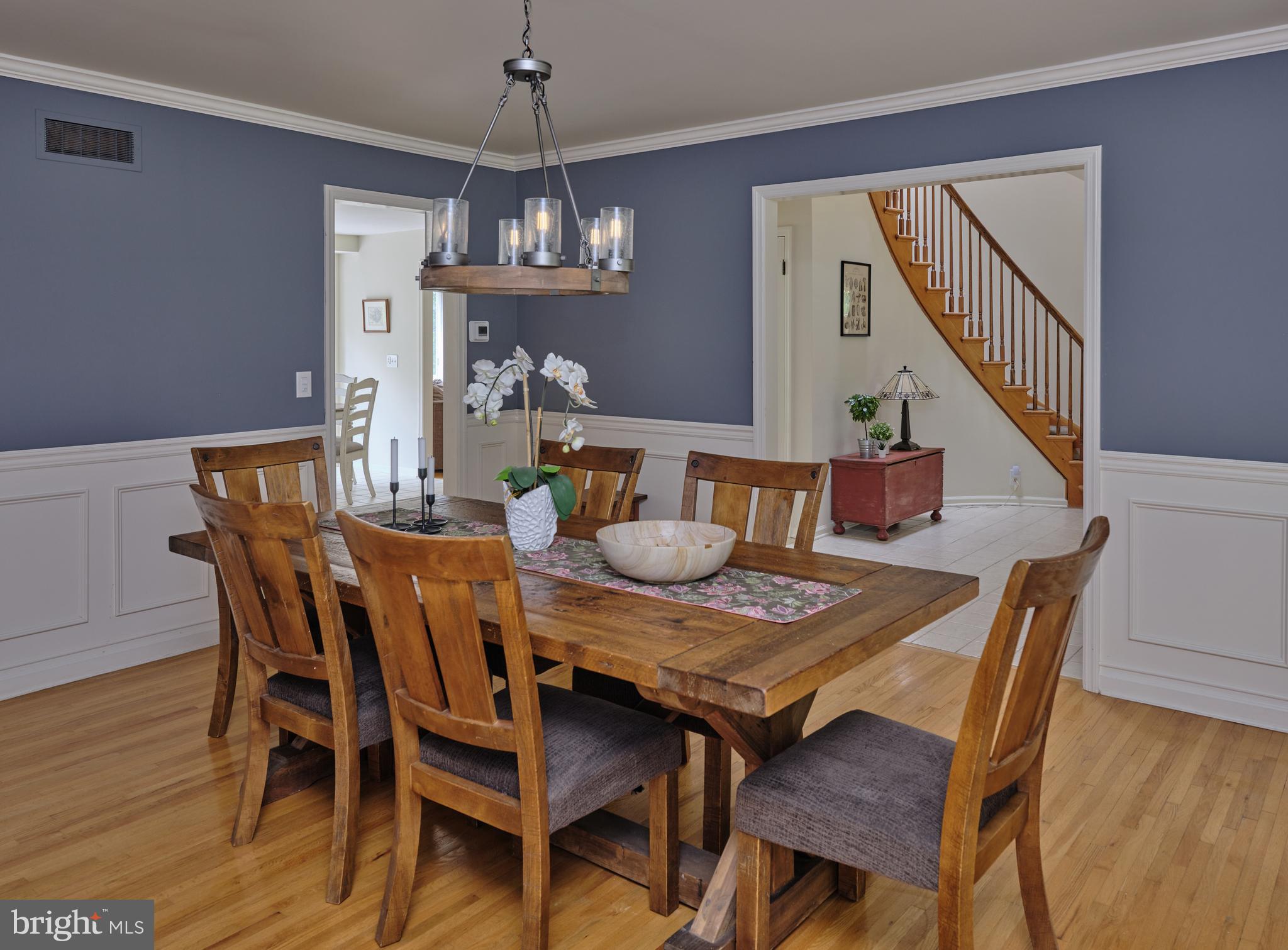 71 Big Spring Road Califon, NJ 07830 - Photo 7 of 41 a view of a dining room with furniture wooden floor and chandelier