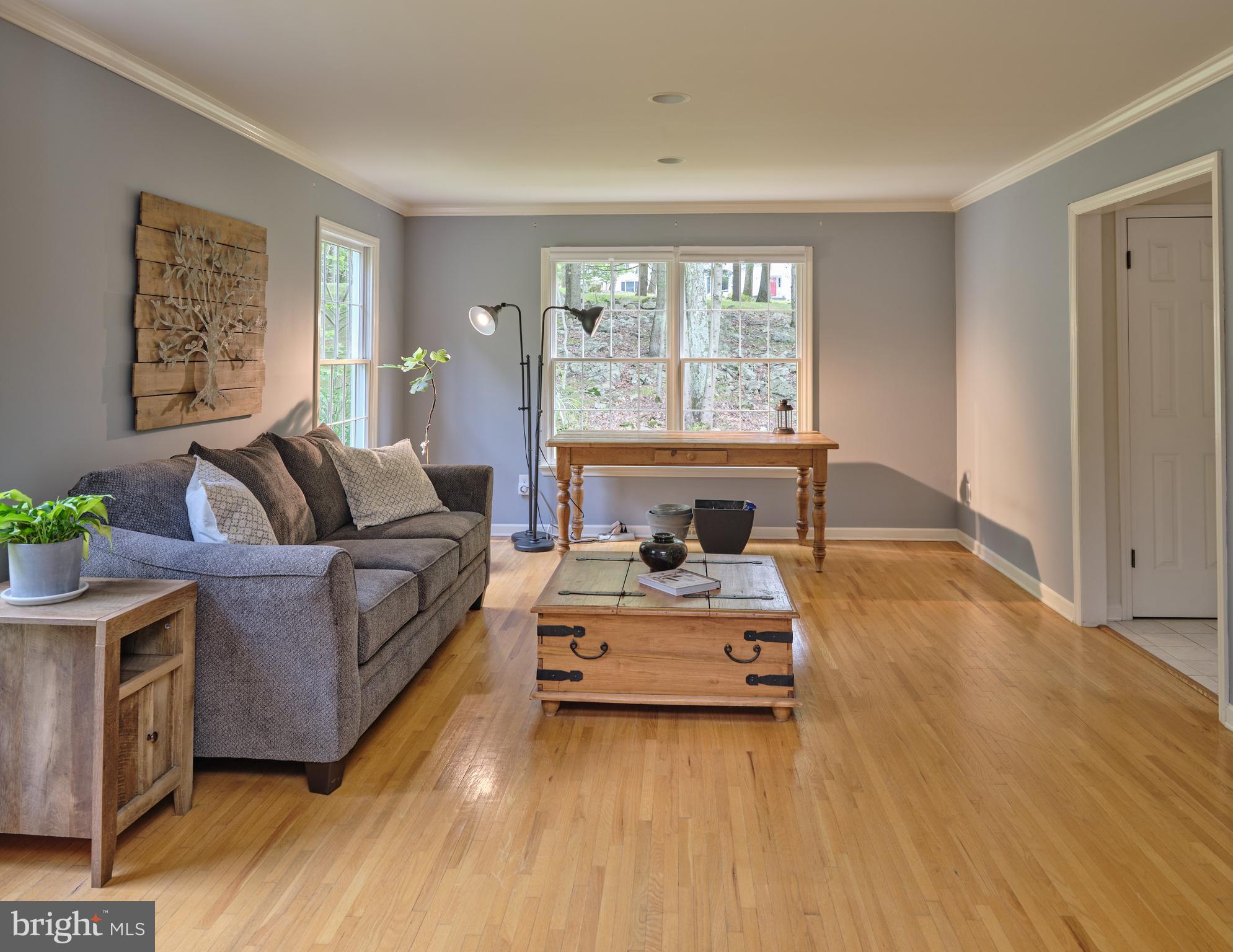 71 Big Spring Road Califon, NJ 07830 - Photo 8 of 41 a living room with furniture and a large window