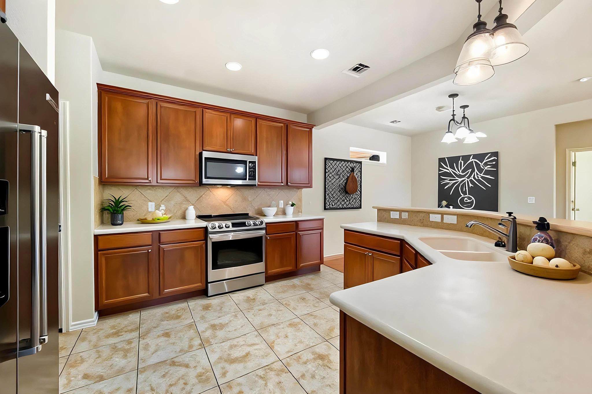 520 Mill Pond Path Georgetown, TX 78633 - Photo 16 of 38 Culinary adventures await in this kitchen, boasting stainless steel appliances and abundant cabinetry.(Virtually staged)