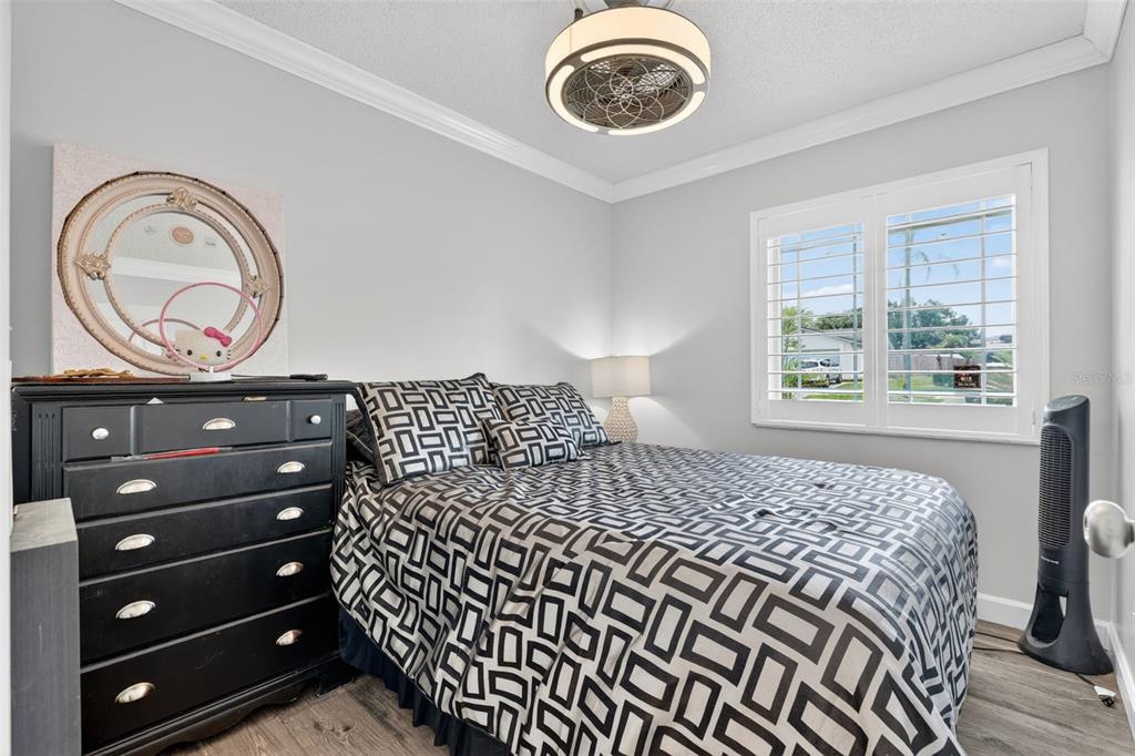 575 Tiberon Cove Road Longwood, FL 32750 - Photo 26 of 56 a bedroom with a bed and a lamp on dresser