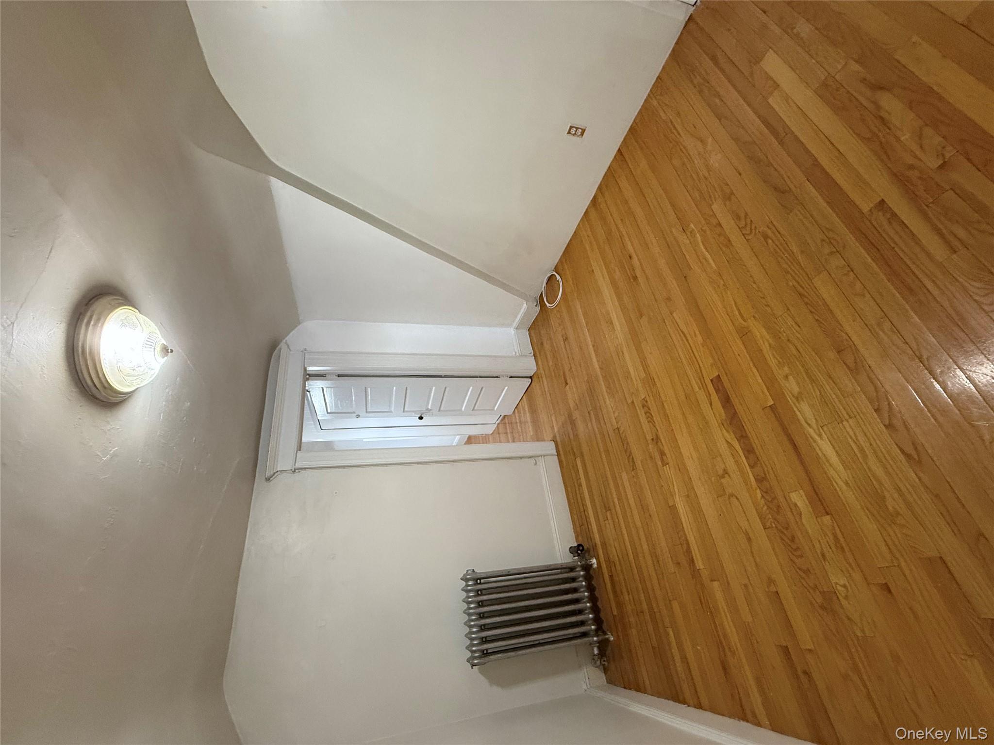 92-40 53rd Avenue, Unit 3 Queens, NY 11373 - Photo 2 of 8 a big room with wooden floor