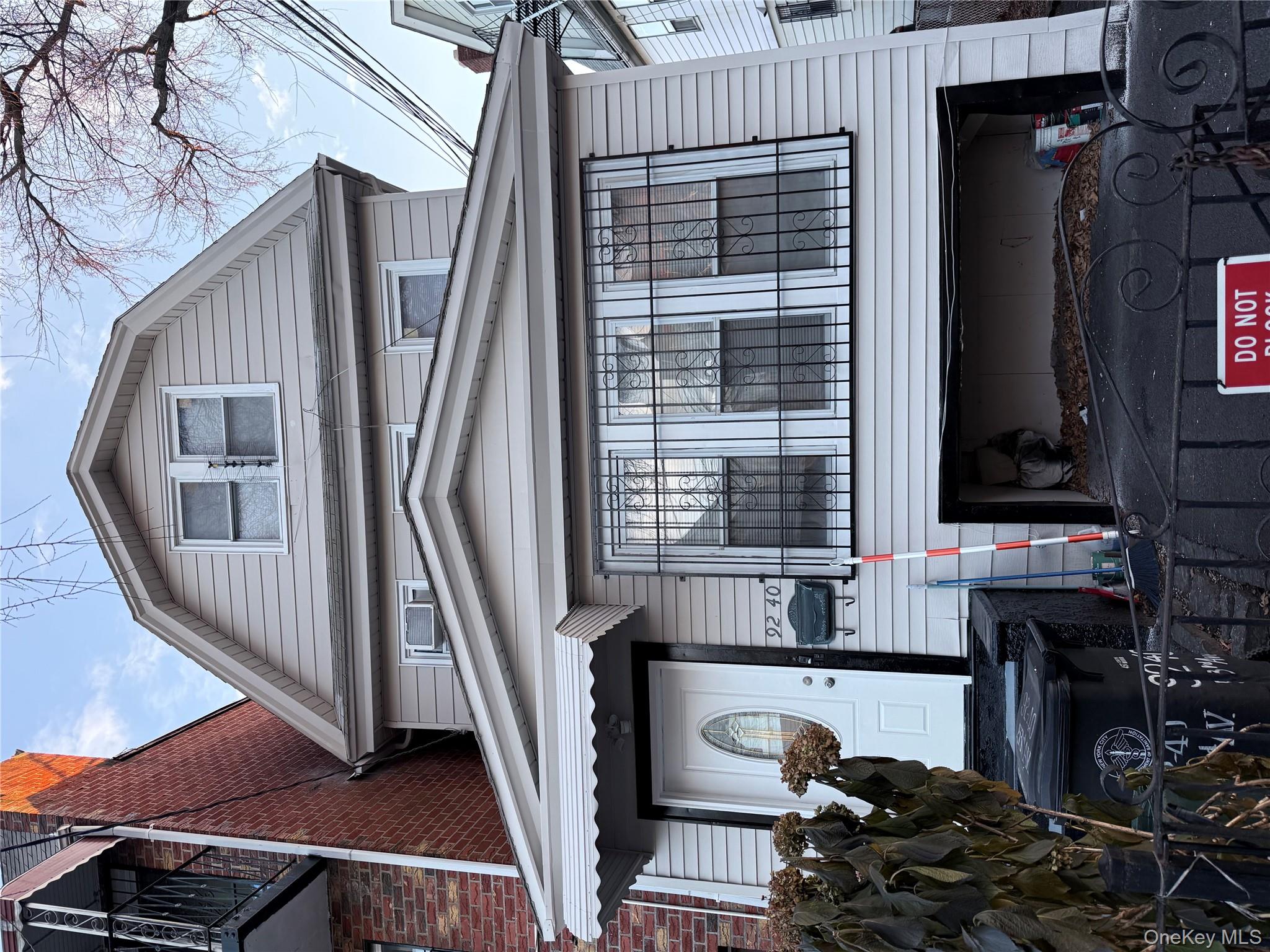 92-40 53rd Avenue, Unit 3 Queens, NY 11373 - Photo 4 of 8 a front view of a house with a balcony