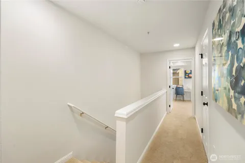 a view of a hallway with a white walls