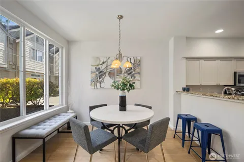 a dining room with furniture and window