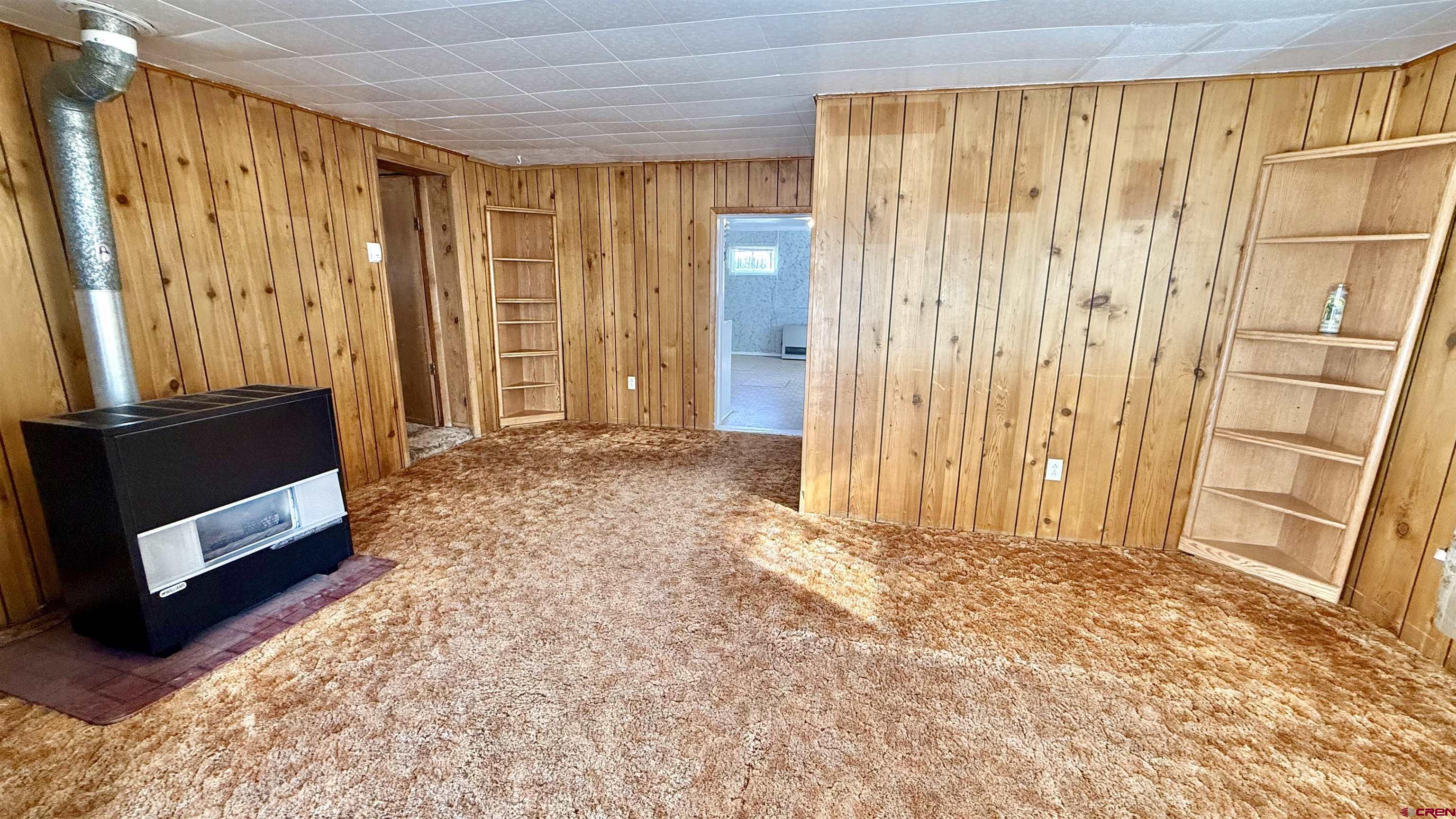 1704 Ross Avenue Alamosa, CO 81101 - Photo 11 of 28 a view of an empty room with a window