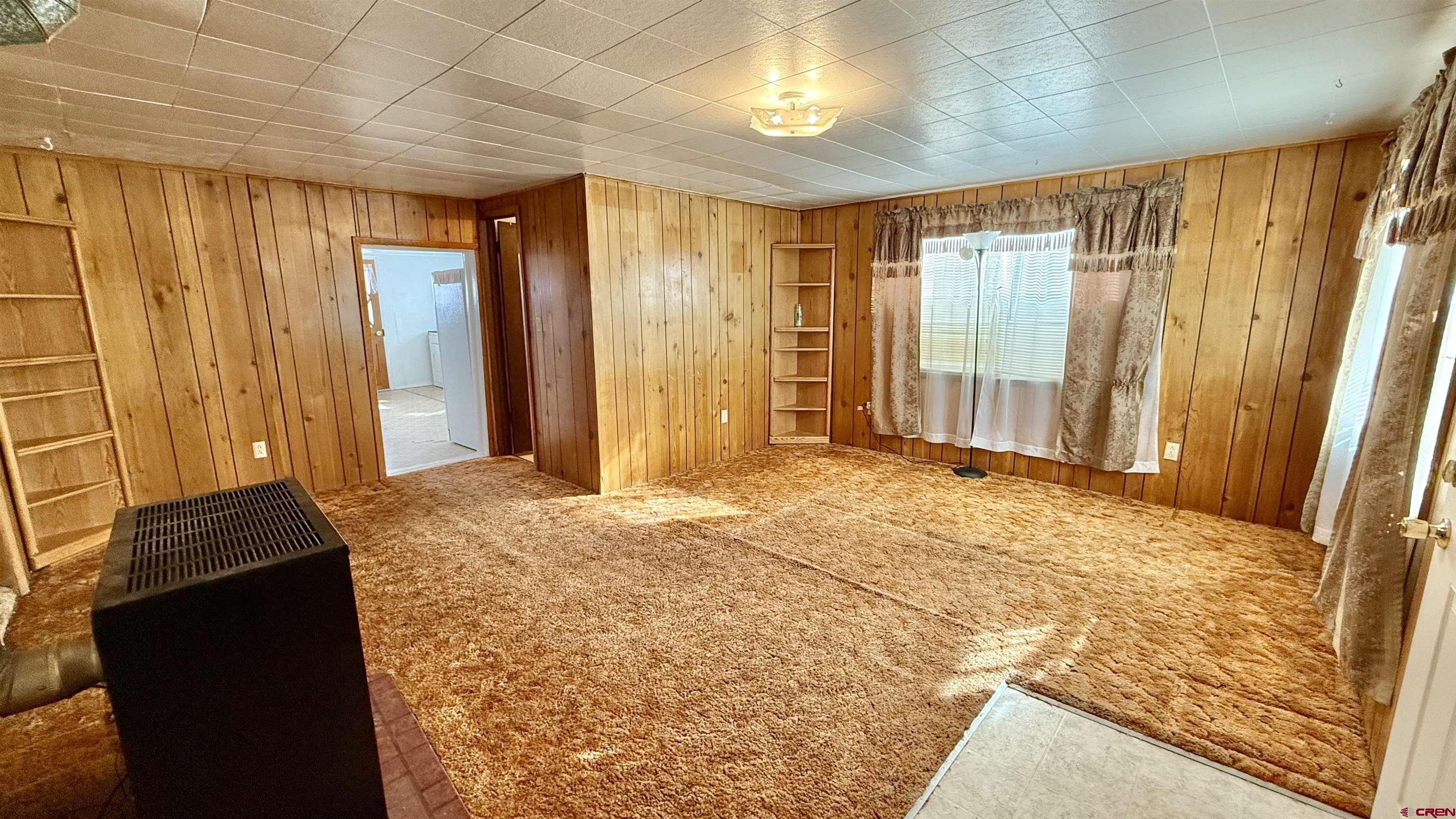 1704 Ross Avenue Alamosa, CO 81101 - Photo 12 of 28 a bedroom with a bed and a window