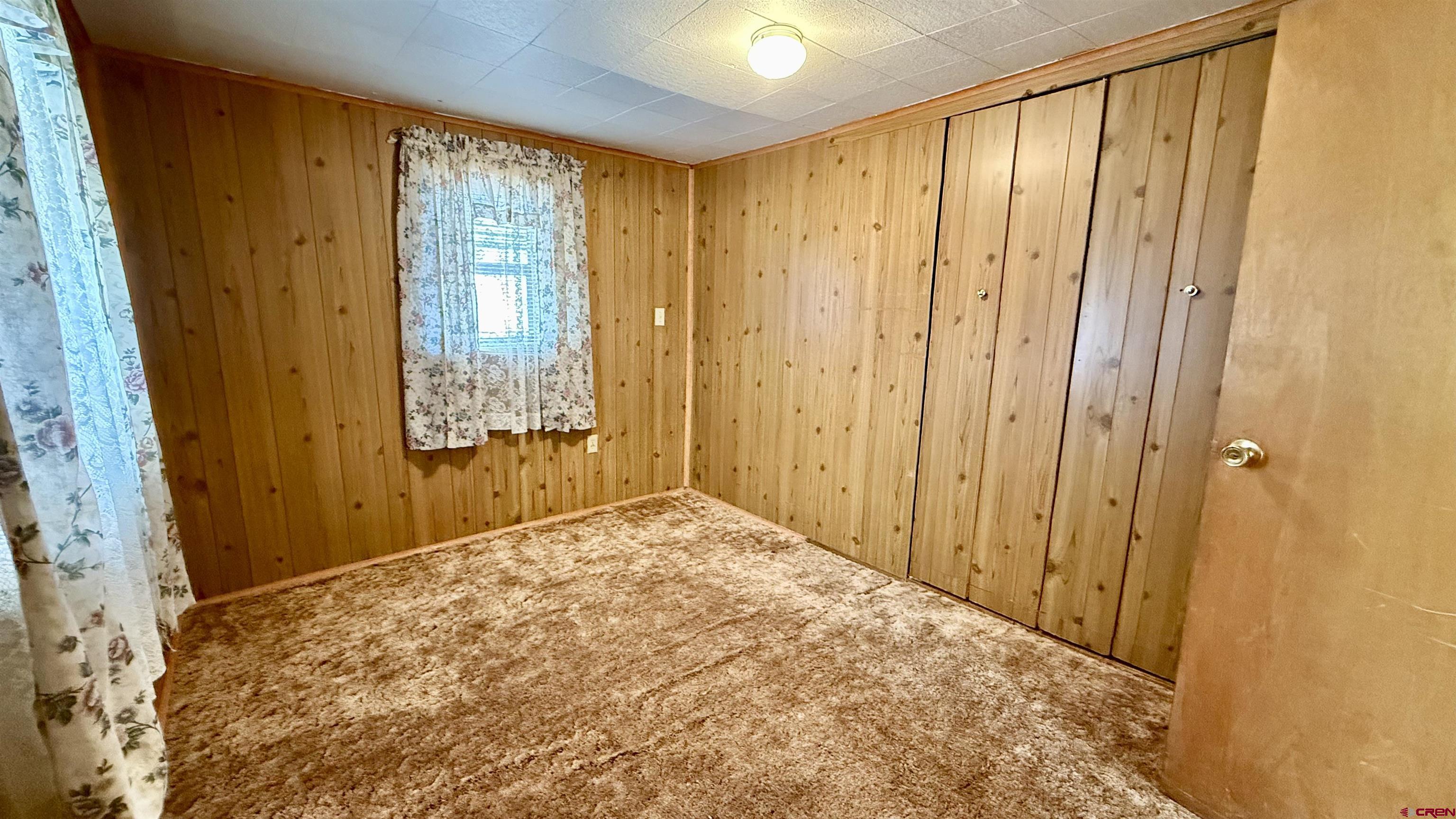1704 Ross Avenue Alamosa, CO 81101 - Photo 14 of 28 a view of an empty room and window