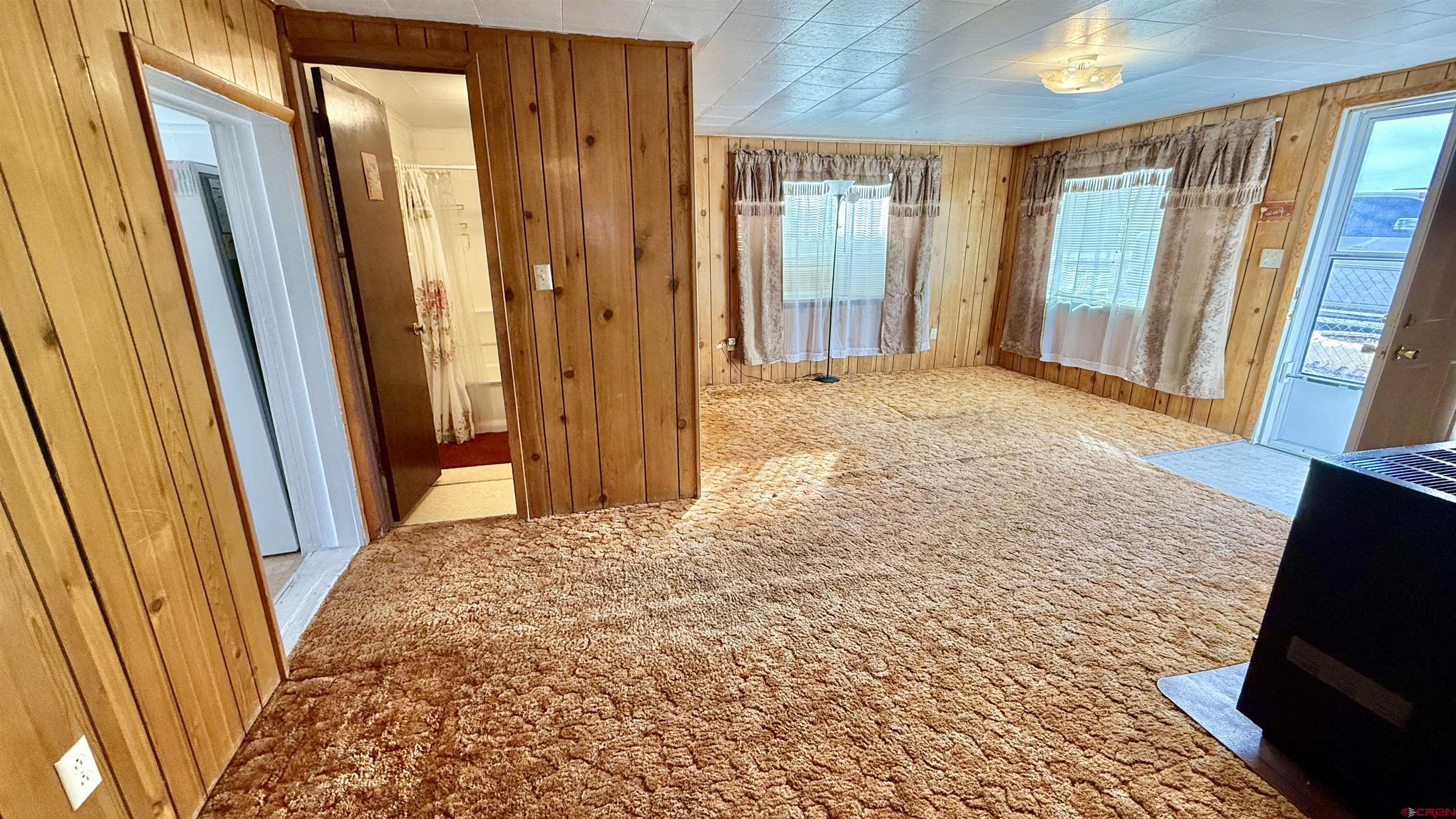 1704 Ross Avenue Alamosa, CO 81101 - Photo 15 of 28 a bedroom with a bed and a window
