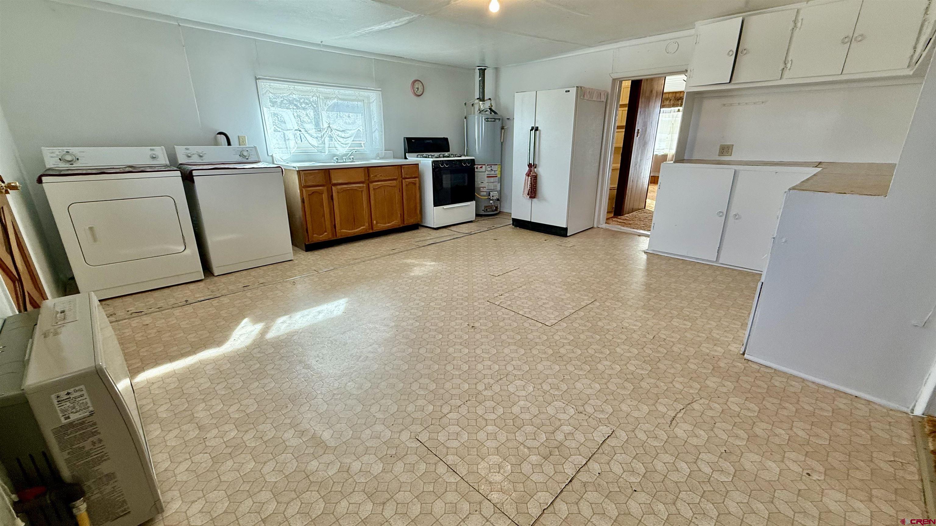 1704 Ross Avenue Alamosa, CO 81101 - Photo 19 of 28 a view of utility room with closet