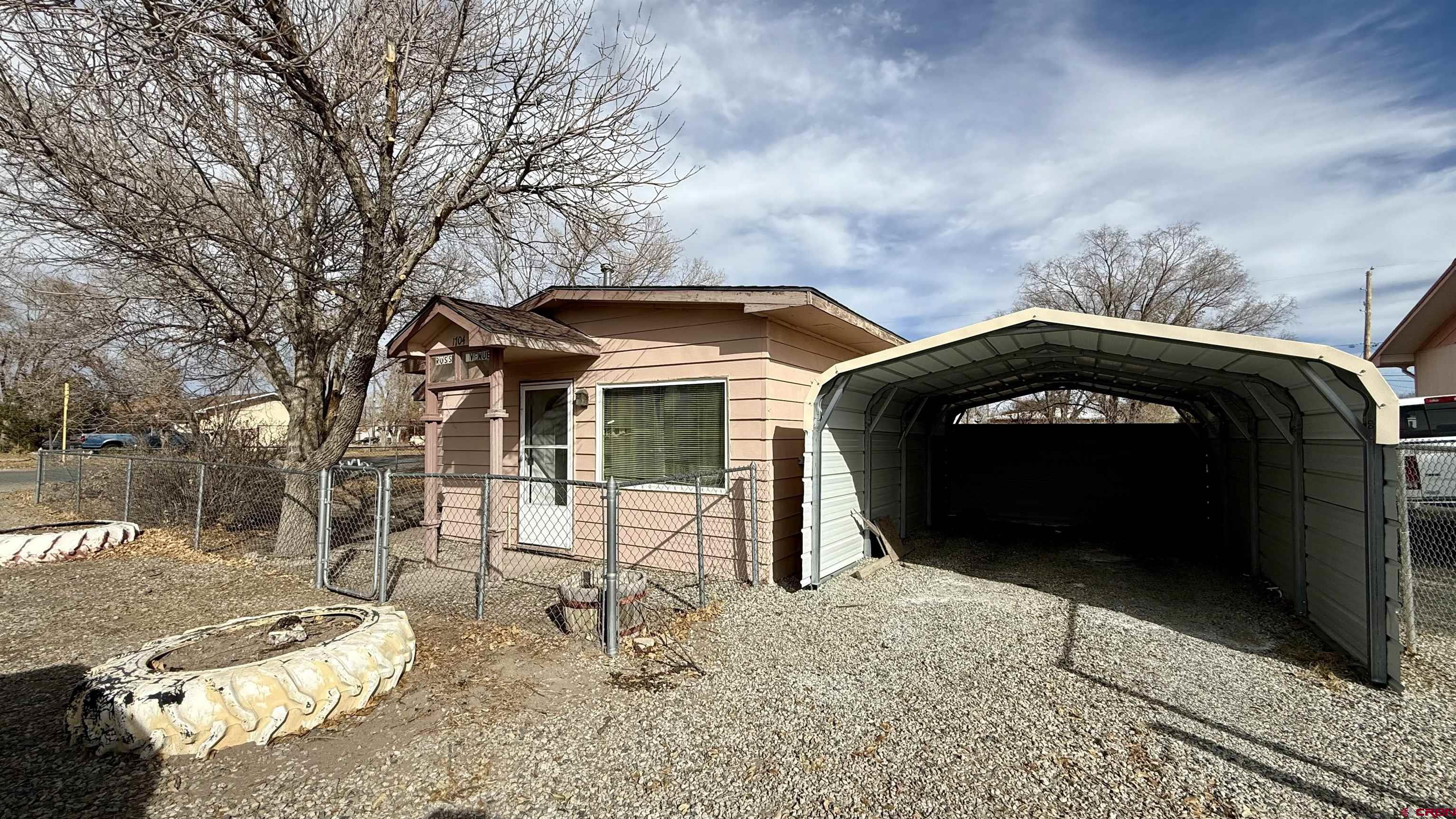 1704 Ross Avenue Alamosa, CO 81101 - Photo 2 of 28 a front view of a house with a yard