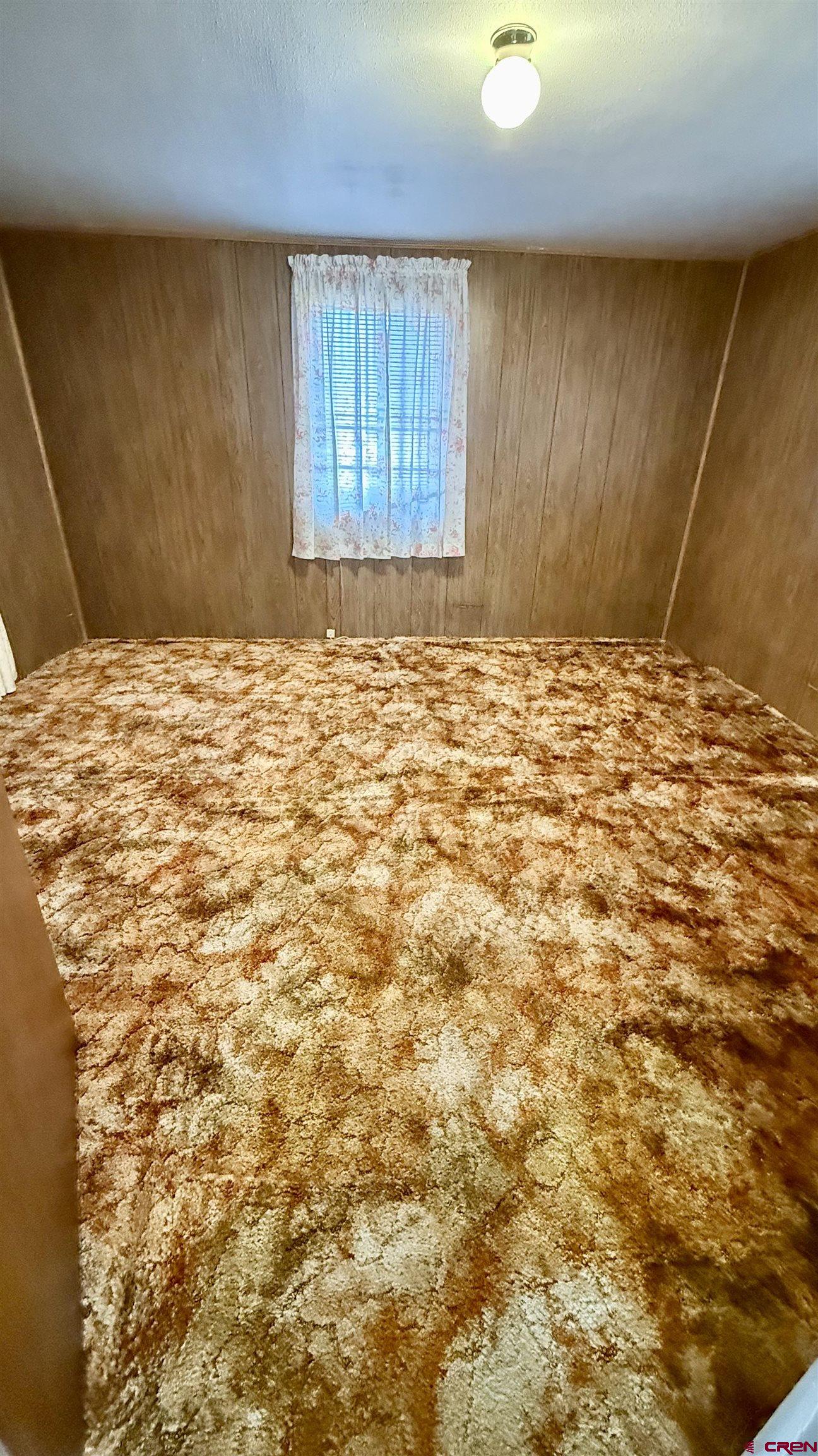 1704 Ross Avenue Alamosa, CO 81101 - Photo 26 of 28 a view of a livingroom with wooden floor and a window