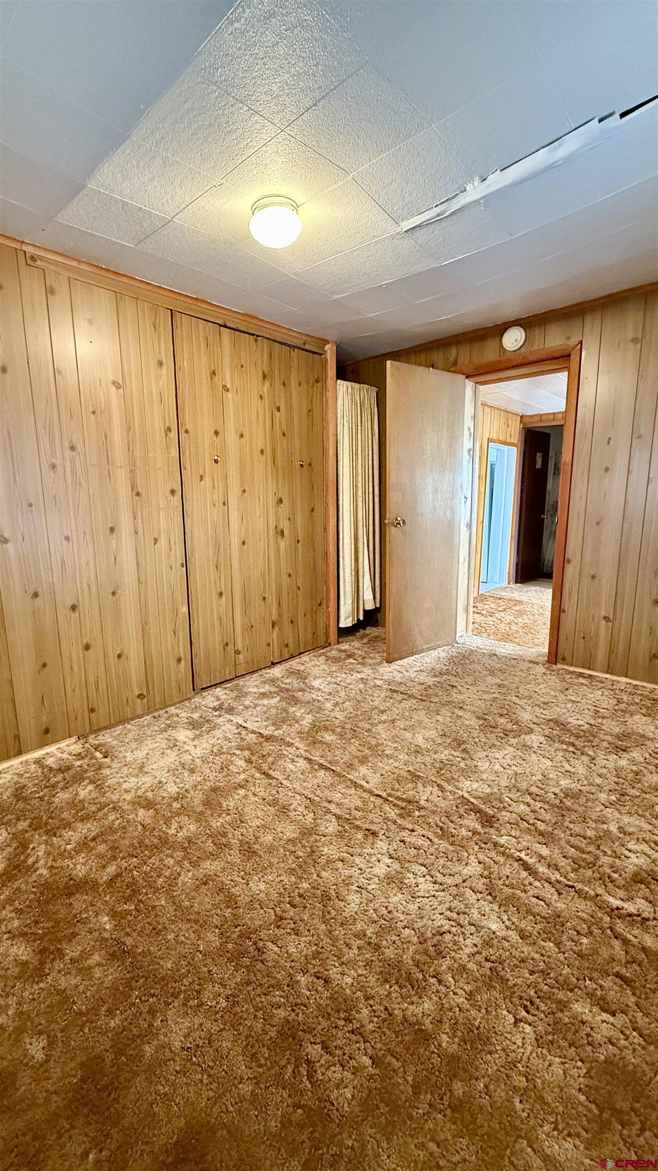 1704 Ross Avenue Alamosa, CO 81101 - Photo 28 of 28 an empty room with windows