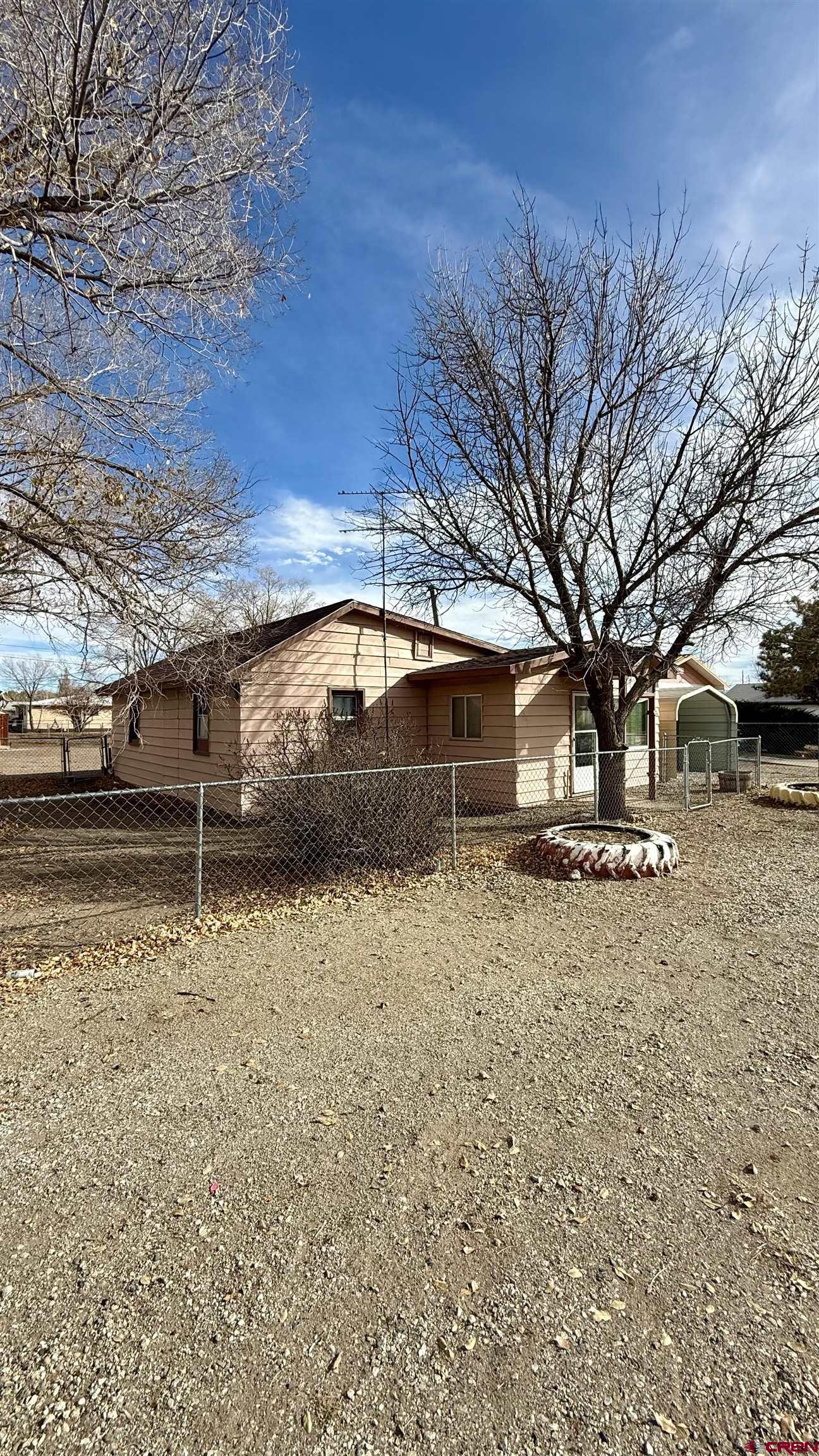 1704 Ross Avenue Alamosa, CO 81101 - Photo 10 of 28 a front view of a house with a yard
