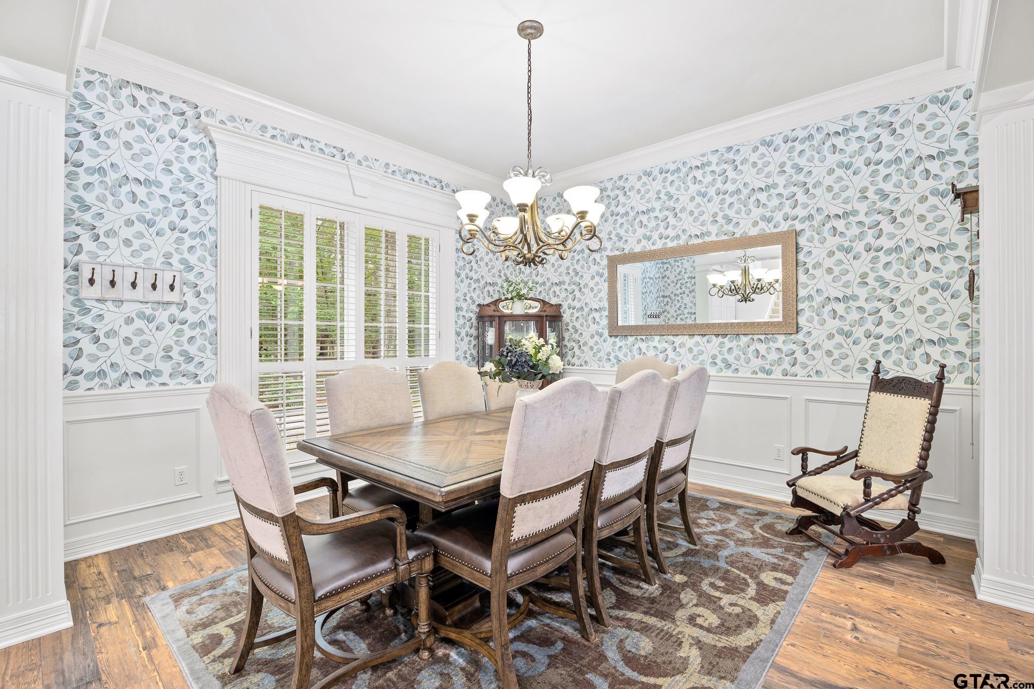 15198 East Ridge Road Arp, TX 75750 - Photo 6 of 48 a dining room with furniture a chandelier and wooden floor