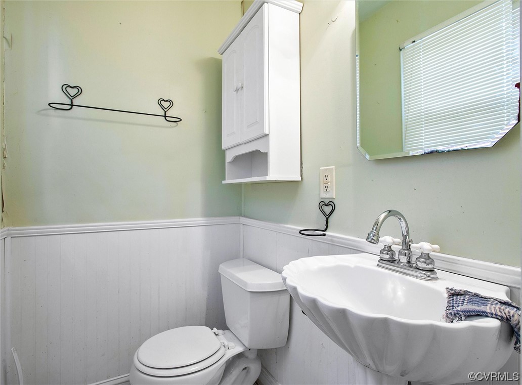 20007 Eugene Drive Sutherland, VA 23885 - Photo 14 of 21 a bathroom with a sink toilet and mirror